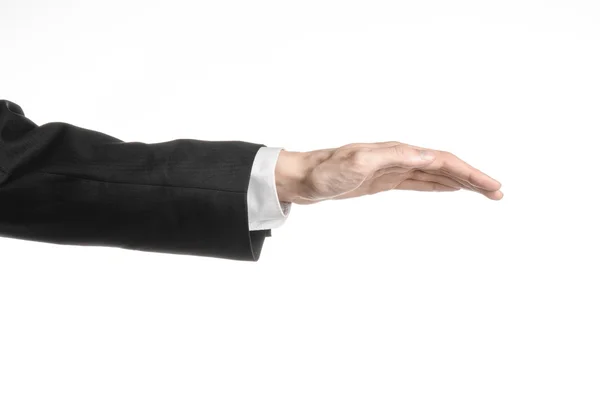 Businessman and gesture topic: a man in a black suit and white shirt showing hand gesture on an isolated white background in studio — Stock Photo, Image