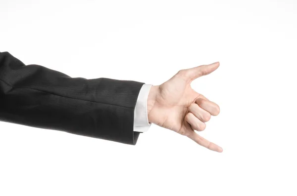 Businessman and gesture topic: a man in a black suit and white shirt showing hand gesture on an isolated white background in studio — Stock Photo, Image