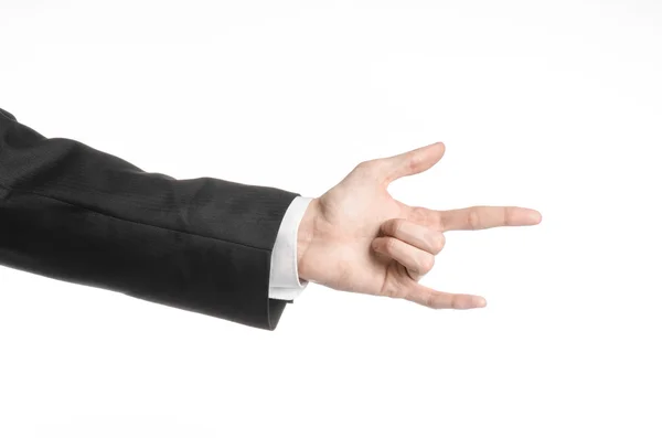 Businessman and gesture topic: a man in a black suit and white shirt showing hand gesture on an isolated white background in studio — Stock Photo, Image