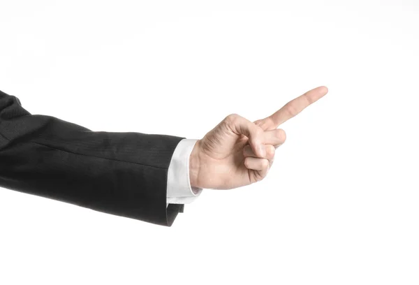 Uomo d'affari e tema del gesto: un uomo in abito nero e camicia bianca che mostra il gesto della mano su uno sfondo bianco isolato in studio — Foto Stock