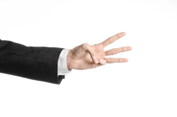 Предприниматель и тема жеста: мужчина в черном костюме и белой рубашке, показывающий жест рукой на изолированном белом фоне в студии — стоковое фото