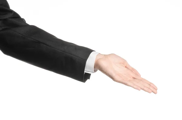 Businessman and gesture topic: a man in a black suit and white shirt showing hand gesture on an isolated white background in studio — Stock Photo, Image