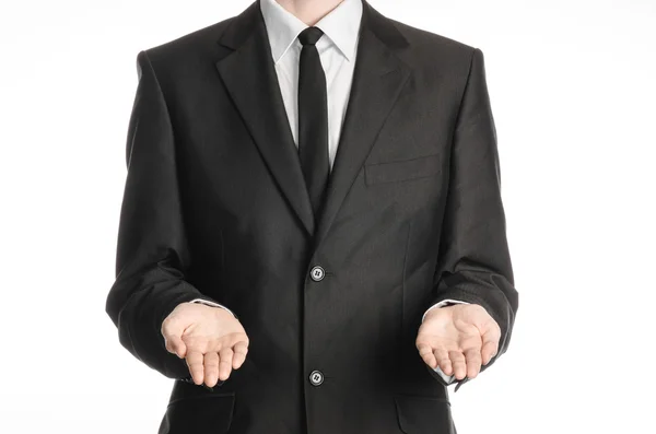Tópico de homem de negócios e gesto: um homem de terno preto e gravata segurando duas mãos na frente isolado em fundo branco no estúdio — Fotografia de Stock