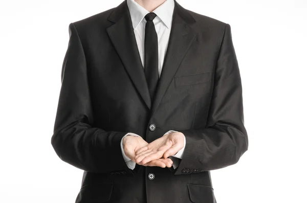 Businessman and gesture topic: a man in a black suit and tie two hands clasped in front of him isolated on a white background in studio — 스톡 사진