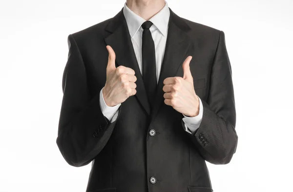 Businessman and gesture topic: a man in a black suit with a tie showing two hands thumbs up isolated on white background in studio — 스톡 사진