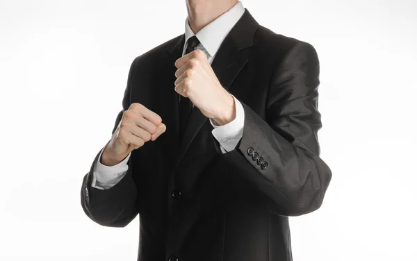 Businessman and gesture topic: a man in a black suit holding his fists in front of him, business struggle — 스톡 사진