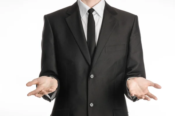 Businessman and gesture topic: a man in a black suit and tie holding hands in front isolated on white background in studio — 스톡 사진