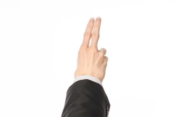 Gestures and Business theme: businessman shows hand gestures with a first-person in a black suit on a white background isolated — Stock Photo, Image