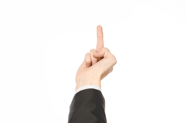 Gestos e tema de negócios: homem de negócios mostra gestos de mão com uma primeira pessoa em um terno preto em um fundo branco isolado — Fotografia de Stock