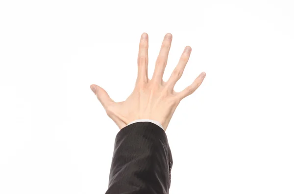 Gestures and Business theme: businessman shows hand gestures with a first-person in a black suit on a white background isolated — Stockfoto