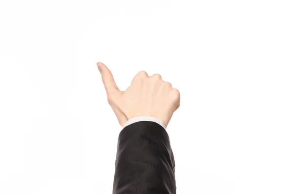 Gestos e tema de negócios: homem de negócios mostra gestos de mão com uma primeira pessoa em um terno preto em um fundo branco isolado — Fotografia de Stock