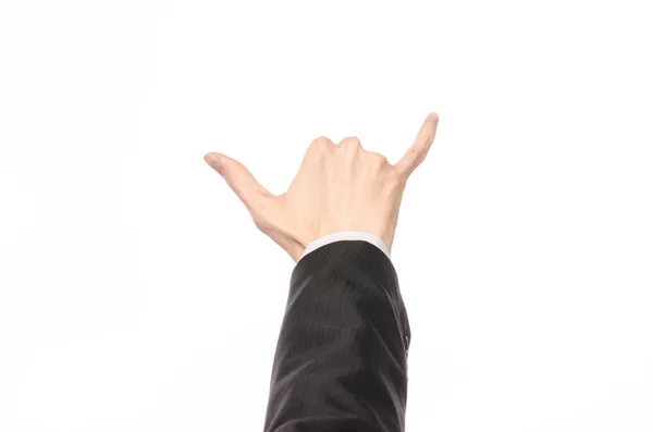 Gestures and Business theme: businessman shows hand gestures with a first-person in a black suit on a white background isolated — Stock Photo, Image