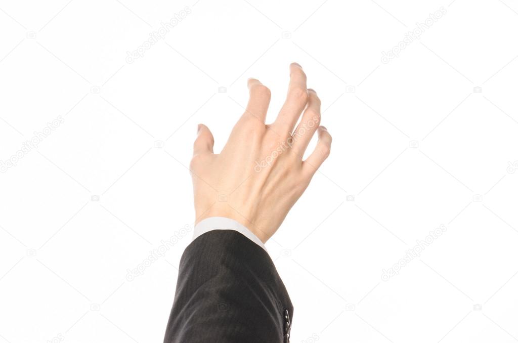 Gestures and Business theme: businessman shows hand gestures with a first-person in a black suit on a white background isolated