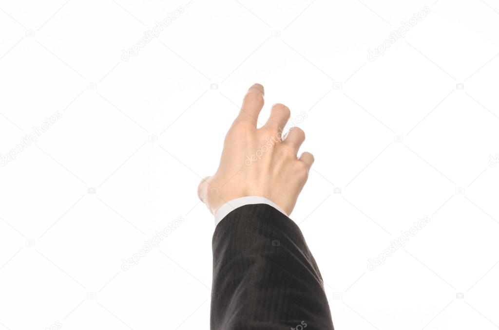 Gestures and Business theme: businessman shows hand gestures with a first-person in a black suit on a white background isolated