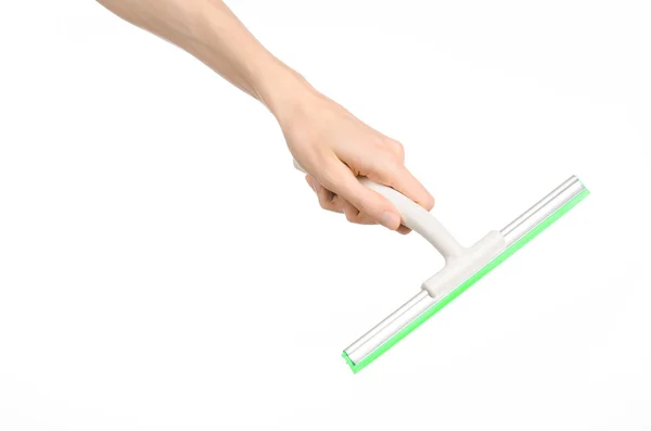 Household cleaning and washing windows theme: man's hand holding a green scraper windows isolated on a white background in the studio. — 스톡 사진