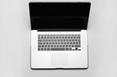 Beautiful gray laptop for work on white background in studio top view
