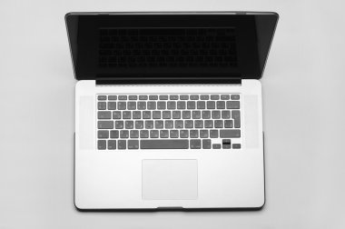 Beautiful gray laptop for work on white background in studio top view