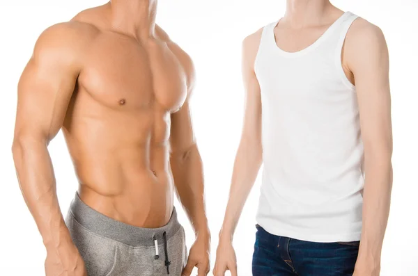 Bodybuilding coach topic: beautiful strong bodybuilder coach stands next to a thin man isolated on a white background in the studio, before and after training in the gym