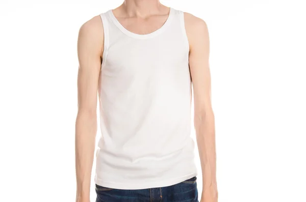 Bodybuilding and Sports theme: a thin man in a white T-shirt and jeans on white isolated background in studio — 图库照片