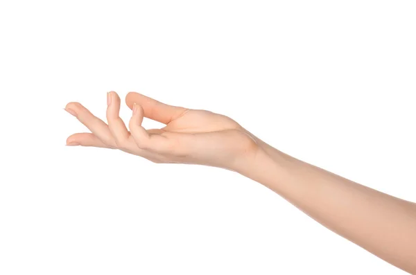 Тема краси і здоров'я: красива елегантна жіноча рука показує жест на ізольованому білому тлі в студії — стокове фото