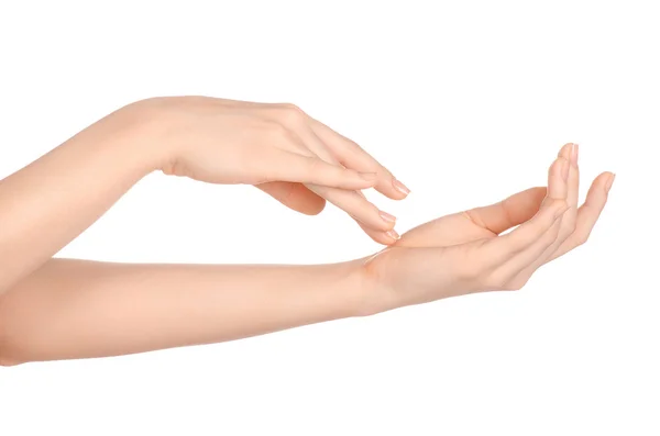 Beauty and Health theme: beautiful elegant female hand isolated on a white background in the studio, using cream advertisement, massage — Zdjęcie stockowe