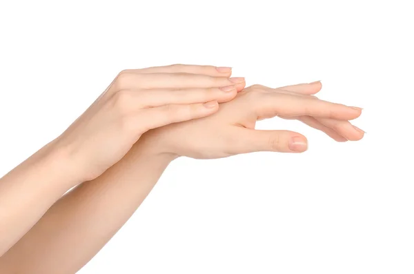 Beauty and Health theme: beautiful elegant female hand isolated on a white background in the studio, using cream advertisement, massage — Zdjęcie stockowe