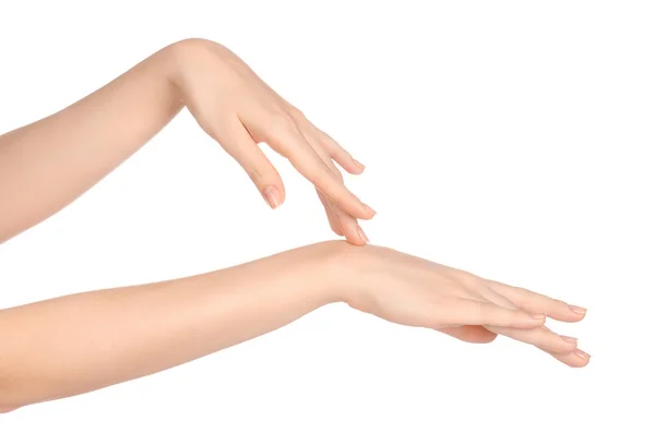 Beauty and Health theme: beautiful elegant female hand isolated on a white background in the studio, using cream advertisement, massage — Zdjęcie stockowe