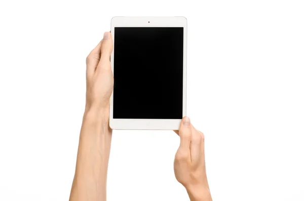 Presentation and advertising touchscreen topic: human hand holding a white tablet touch computer gadget with touch blank black screen isolated on a white background in studio — Stock Photo, Image