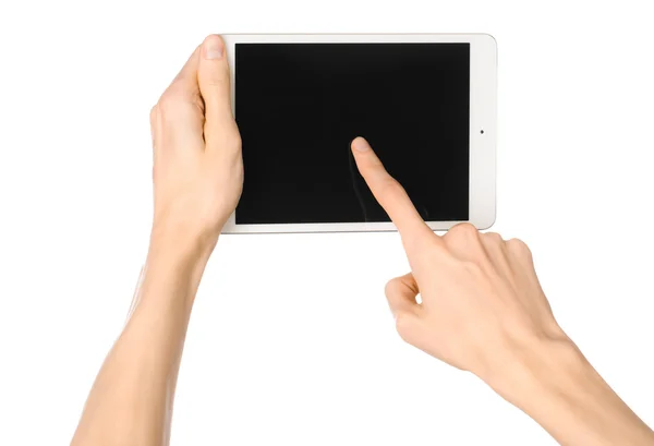 Presentation and advertising touchscreen topic: human hand holding a white tablet touch computer gadget with touch blank black screen isolated on a white background in the studio, first-person view — Stock Photo, Image