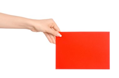 Branding and advertising theme: beautiful female hand holding a blank red paper card isolated on white background