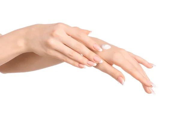 Tema salute e cura del corpo: bella mano femminile con crema bianca isolata su sfondo bianco, massaggio alle mani — Foto Stock