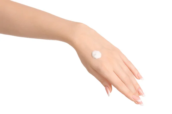 Salud y cuidado corporal tema: hermosa mano femenina con crema blanca aislada sobre un fondo blanco, masaje de manos —  Fotos de Stock
