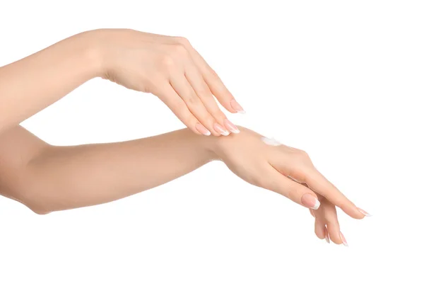 Health and body care theme: beautiful female hand with white cream isolated on a white background, hand massage — Stock Photo, Image