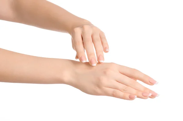 Egészségügyi és a test gond téma: gyönyörű női kéz, fehér krémmel elszigetelt fehér background, kézmasszázs — Stock Fotó