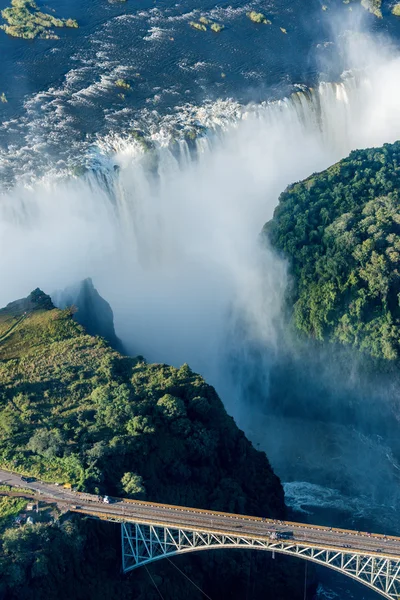 Victoria Falls bridge with falls in background — Stock Photo, Image