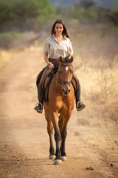 Brunette Rides Horse Dirt Track Smiling — Stock Photo, Image