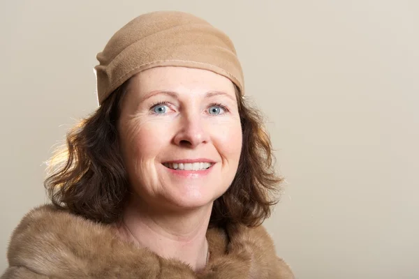 Smiling brunette in brown hat and fur — Stock Photo, Image