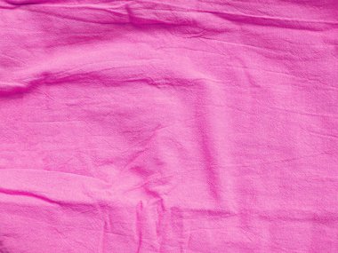 Pamuk kumaşın arkaplan dokusu pembe. Metnin ve tasarımın için uzayı kopyala. Tekstil konsepti ve yumuşak fon, düz la