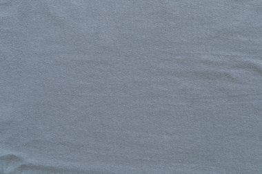 Arka plan için gri pamuk kumaş. Tekstil ürünü konsepti, tişört ürünü