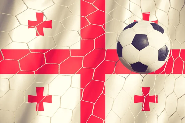 Bandera de Georgia y pelota de fútbol, fútbol en color vintage de la red de gol — Foto de Stock