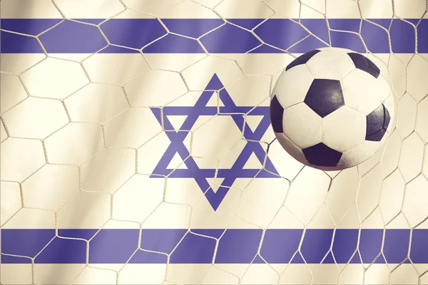 Israel flag and soccer ball, Fußball im Tornetz vintage color — Stockfoto