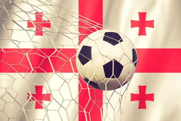 Bandera de Georgia y pelota de fútbol, fútbol en color vintage de la red de gol — Foto de Stock