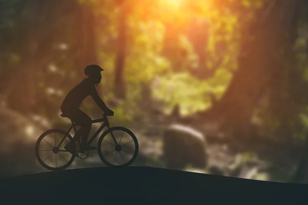 Silhouette of a man on muontain-bike, sunset — Stock Photo, Image