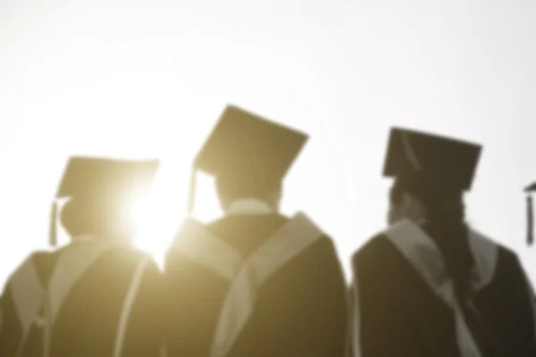 Blurry Graduates are walking in line to get your degree,monotone — Stock Photo, Image