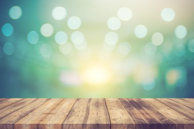 Wood table top on blue bokeh abstract background - can be used f