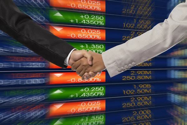 Handshake over stock market chart — Stock Photo, Image