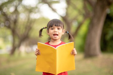pretty girl The little girl is happy with the book