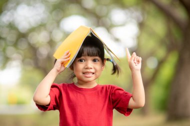 pretty girl The little girl is happy with the book
