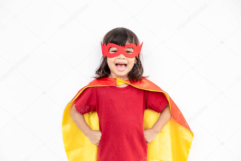 Kids concept, smiling girl playing super hero on white background