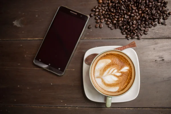 Latte Art coffee with coffee bean — Stock Photo, Image